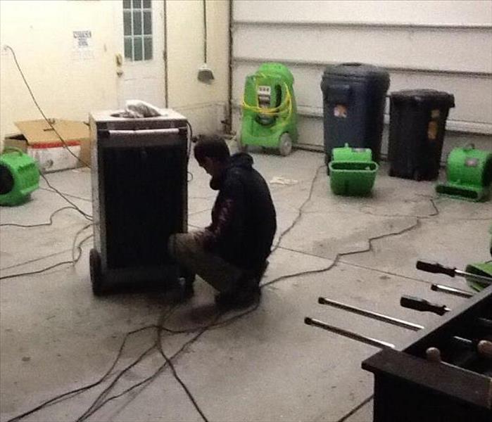 Technician drying a commercial property